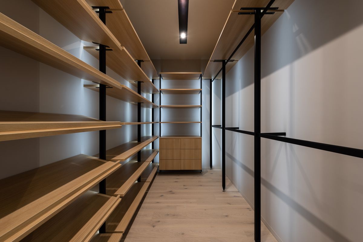 Organized wardrobe with shelves and hanging storage